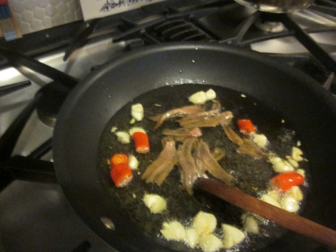 Anchovies cooking