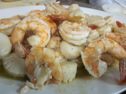 Multiple pounds of shrimp and scallops prepared scampi style.