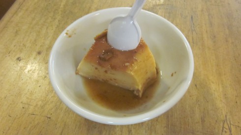 A flan that holds a spoon.