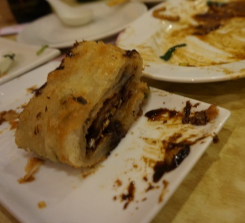 The lone slice of scallion pancake before snared by Gerry.