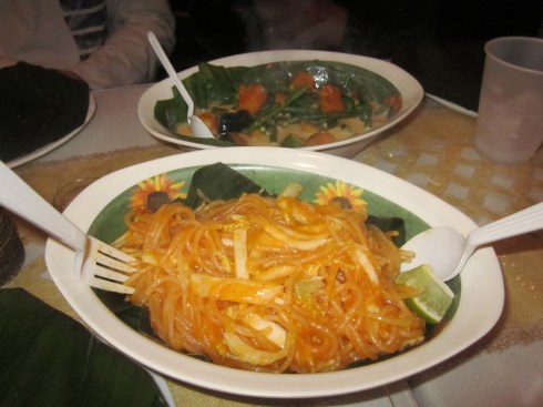 Pancit Palabok with sitaw kalabasa in the background.